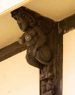 A 16th century wooden bracket is carved to represent a succubus